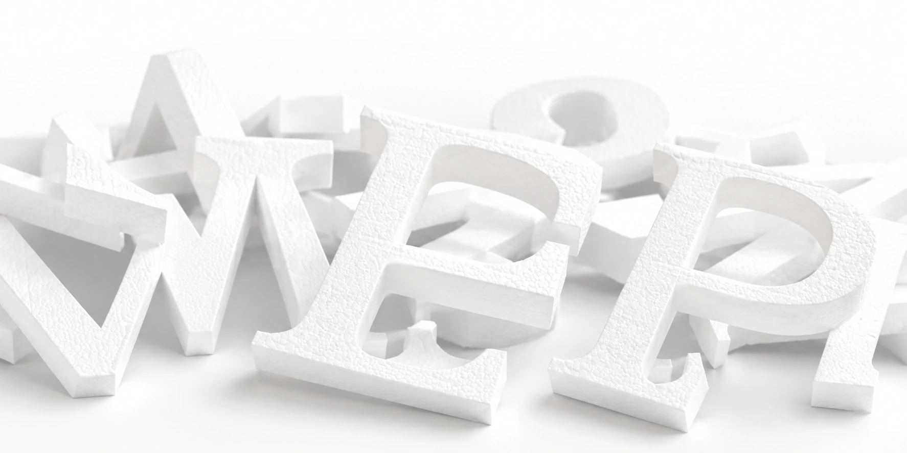 Illustration de lettres blanches en polystyrène découpées en volume